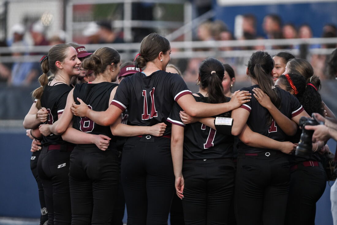 Summit Hilltoppers huddled together before a game