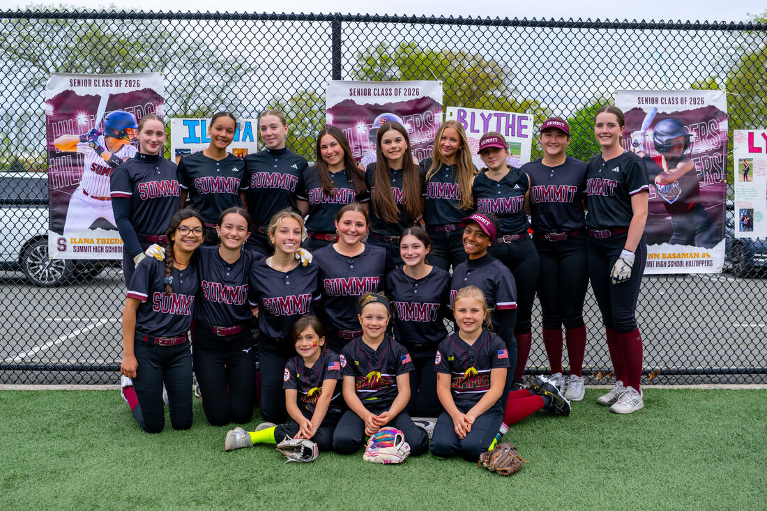 Team photo in front of Senior Class of 2026 banners