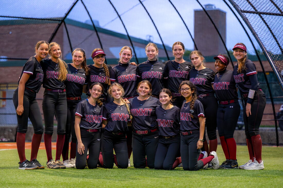 Team photo inside the batting cage